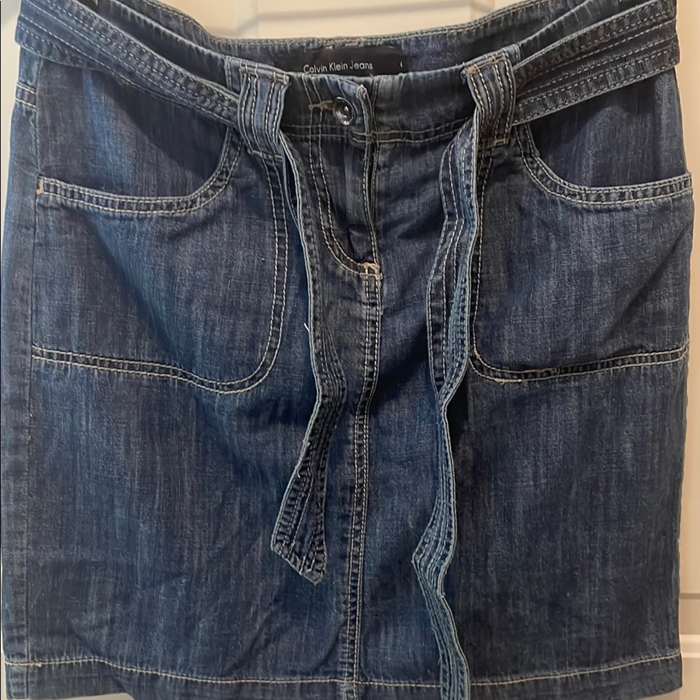 Calvin Klein distressed denim skirt with matching removable belt